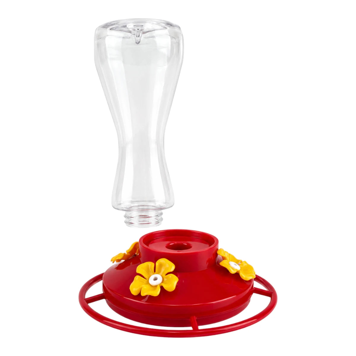 Contenedor de plástico transparente separado de su base roja enroscable, demostrando el sistema desmontable del bebedero para colibríes Redkite, en Kamalitas.