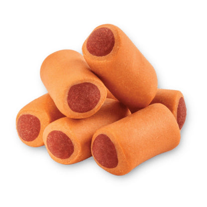 Primer plano detallado de los Premios Bites de Hot Dog Ganador Premium, mostrando su original forma de mini hot dog con 'cátsup y mostaza', textura blanda y sabor irresistible para perros, en Kamalitas.