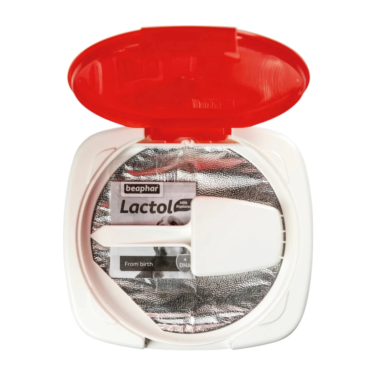 Vista del interior del envase de Beaphar Lactol, mostrando la bolsa sellada, cuchara dosificadora y tapa protectora