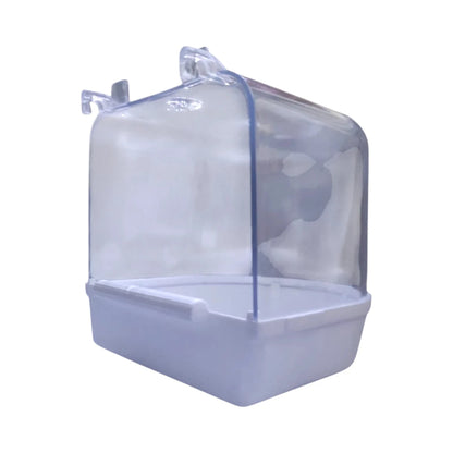 Vista trasera de Bañera exterior de plástico resistente con tapa transparente y base blanca, diseñada para canarios y periquitos. se aprecian los ganchos con los que se sujeta a la jaula